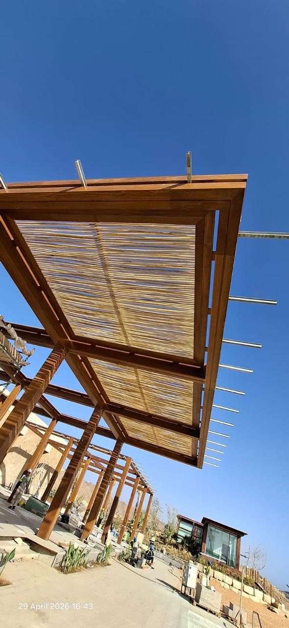 Timber pergola structure with woven canopy